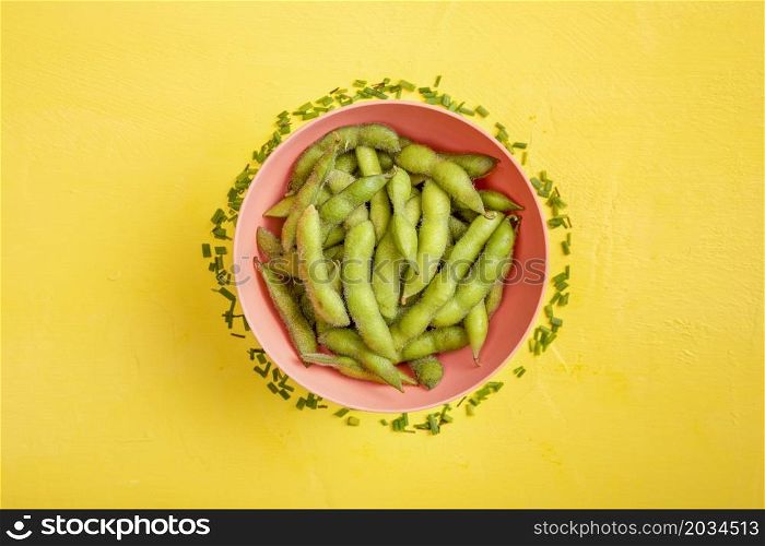 flat lay edamame beans bowl with fresh cut chives