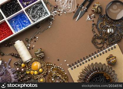 flat lay essentials bead working with scissors notebook