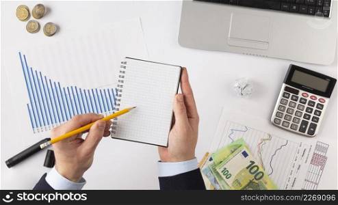 flat lay finances elements composition with empty notepad
