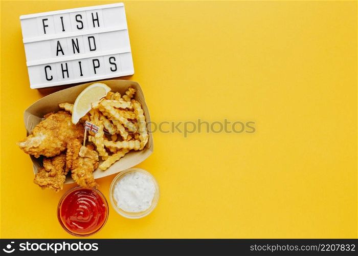 flat lay fish chips with sauce light box