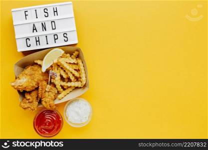 flat lay fish chips with sauce light box