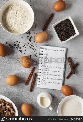 flat lay food ingredients with notebook dessert mix