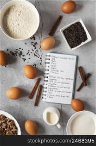 flat lay food ingredients with notebook dessert mix