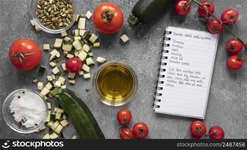 flat lay food ingredients with notebook veggies