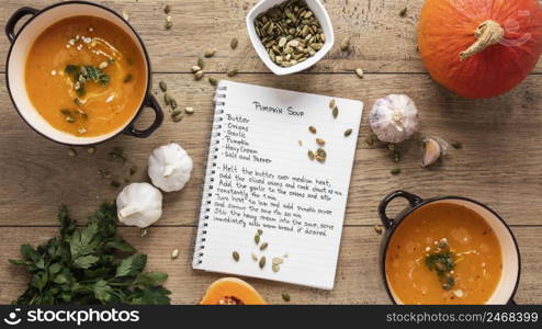 flat lay food ingredients with pumpkin soup notebook