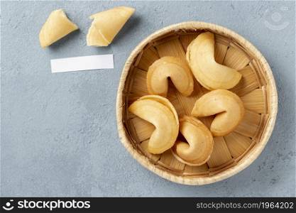 flat lay fortune cookies bowl with blank note. High resolution photo. flat lay fortune cookies bowl with blank note. High quality photo