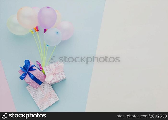 flat lay frame with colorful balloons gifts