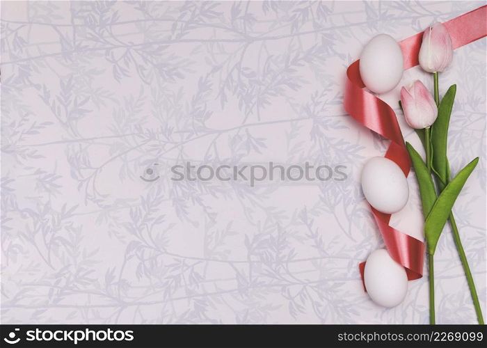 flat lay frame with eggs tulips easter