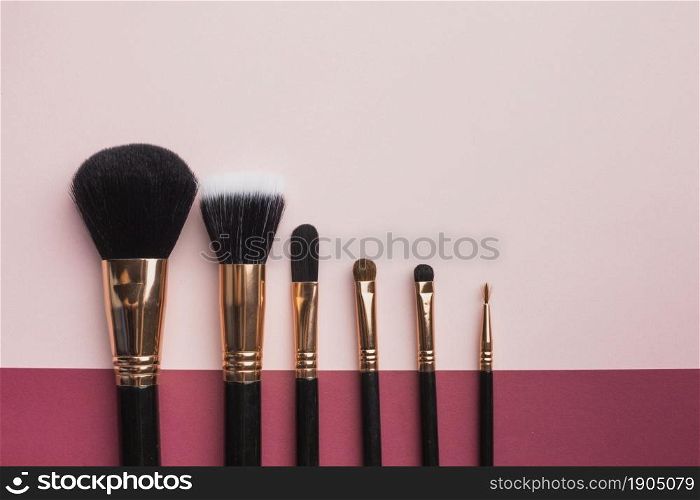 flat lay frame with make up brushes pink background. Beautiful photo. flat lay frame with make up brushes pink background