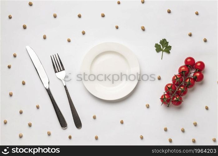 flat lay fresh tomatoes with plate cutlery. High resolution photo. flat lay fresh tomatoes with plate cutlery. High quality photo