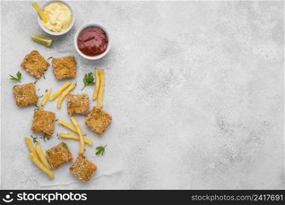 flat lay fried chicken nuggets with french fries copy space
