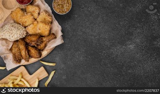 flat lay fried chicken with french fries copy space