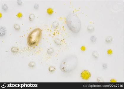 flat lay golden egg easter with dandelions glitter