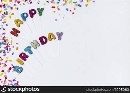 flat lay happy birthday lettering white background with copy space. Beautiful photo. flat lay happy birthday lettering white background with copy space