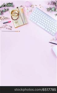 Flat lay home office workspace. Flat lay home office workspace - white modern keyboard with female accessories, copy space on pink background