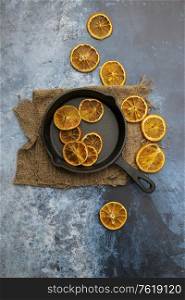 Flat lay image of dried seasonal Winter fruit on textured rough background