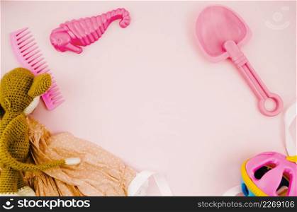 flat lay kids toys with pink background