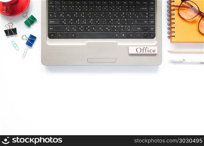Flat lay laptop computer with stationary, notebook and eyeglasse. Flat lay laptop computer with stationary, notebook and eyeglasses on white background with copy space, Business and workspace