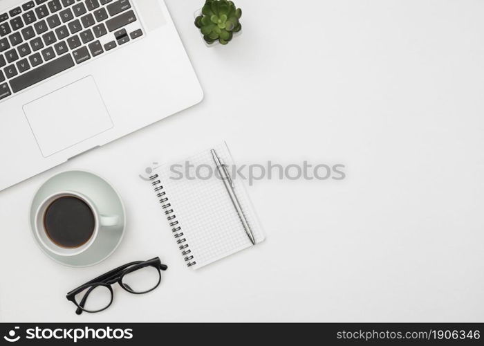 flat lay laptop mockup with notepad