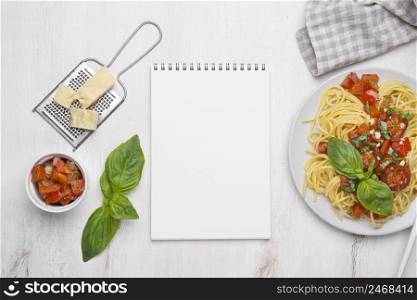 flat lay local food meal arrangement with notepad