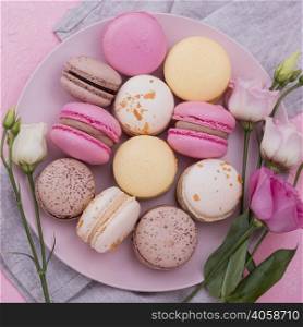 flat lay macarons plate with roses