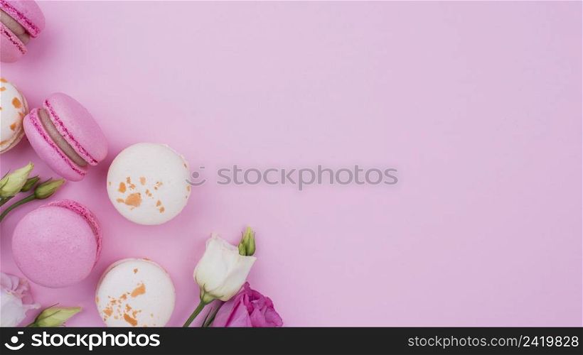 flat lay macarons with roses copy space