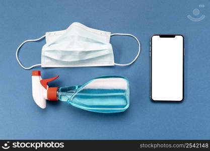 flat lay medical mask with blank phone