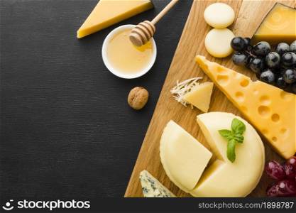 flat lay mix gourmet cheese grapes cutting board with honey. Resolution and high quality beautiful photo. flat lay mix gourmet cheese grapes cutting board with honey. High quality beautiful photo concept