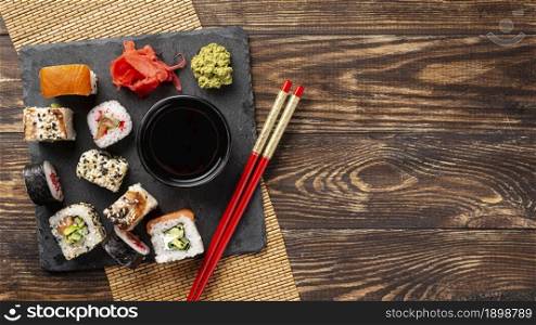 flat lay mix maki sushi rolls chopsticks with copy space. Resolution and high quality beautiful photo. flat lay mix maki sushi rolls chopsticks with copy space. High quality beautiful photo concept