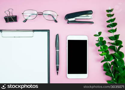 Flat lay mock-up photo with Creative header design mockup set of workspace desk with blank of free copy space screen smartphone Tropical Leave on Pink Pastel color background, Technology concept minimal style. Flat lay mock-up photo with Creative header design mockup set of