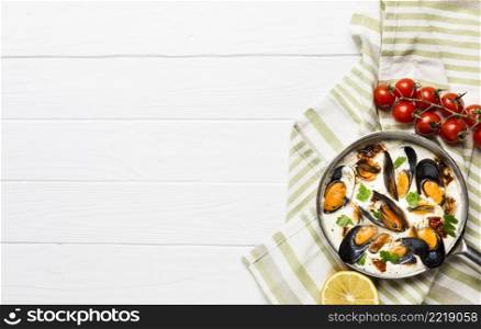 flat lay mussels white sauce sides tablecloth with copyspace
