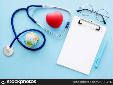 flat lay notepad with heart shape stethoscope