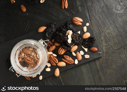 flat lay oats jar with nuts mix dates