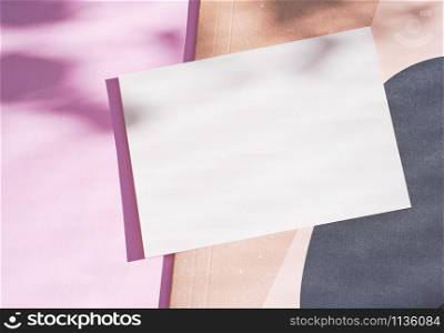 Flat lay of branding identity blank postcard on pink background with light and shadow from leaves botany, minimal concept for design