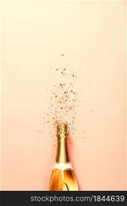 Flat lay of Celebration. Champagne bottle with ice cream sprinkles and golden star sprinkles on pink gradient background. Top view. Flat lay of Celebration. Champagne bottle with sprinkles on pink background.