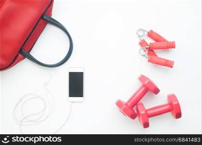 Flat lay of smartphone and sport equipments on white background, Workout and Healthy lifestyle concept
