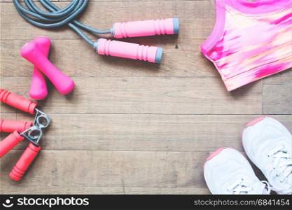 Flat lay of sport equipments and accessories for woman on wood background, Beauty and Healthy concept