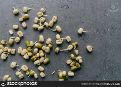 Flat lay of sprouted mung beans for culinary use, isolated over grey background. Fresh organic vegan food. Healthy nutrition concept