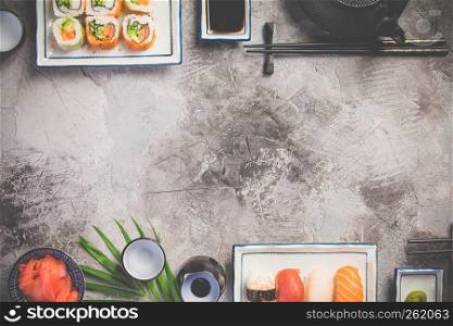 Flat-lay of sushi set on grey concrete background. Flat-lay of sushi set on grey concrete background, horizontal composition
