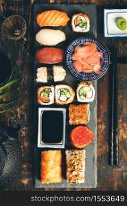 Flat-lay of sushi set on old wooden background. Flat-lay of sushi set on old wooden background, flat lay