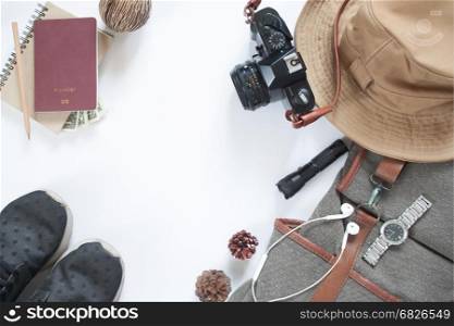 Flat lay of travel accessories with camera and passport isolated on white background