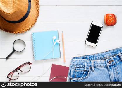 Flat lay of traveler's accessories with smart phone, Application mock up on mobile