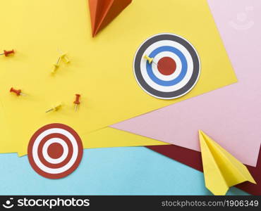 flat lay paper targets with pins paper planes. High resolution photo. flat lay paper targets with pins paper planes. High quality photo