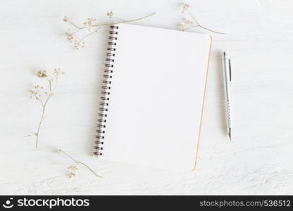 Flat lay photo of office desk on white background,empty notebook open on white wood table