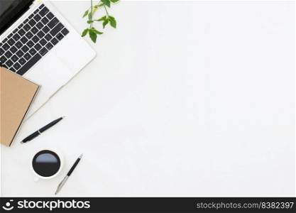 Flat lay photo of office desk with laptop, notebook, pen, coffee with copy space background