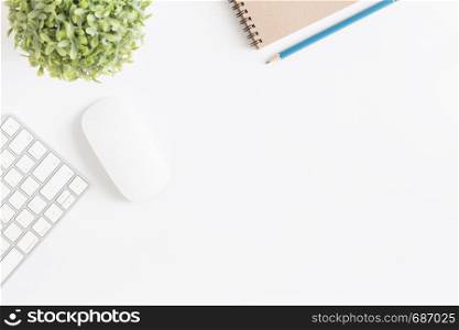 Flat lay photo of office desk with mouse and keyboard,Copy space on white background with notebook and pencil,Top view