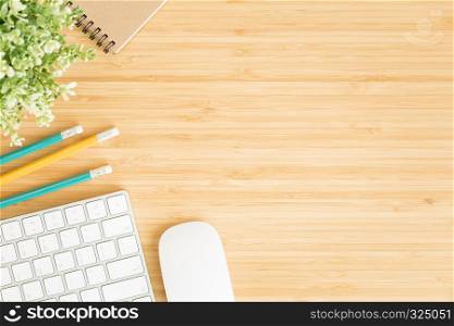 Flat lay photo of office desk with mouse and keyboard ,Top view workpace on bamboo wood table and copy space