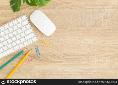 Flat lay photo of office desk with mouse and keyboard ,Top view workpace on wood table and copy space