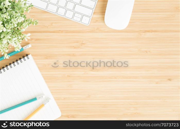 Flat lay photo of office desk with mouse and keyboard ,Top view workpace on bamboo wood table and copy space