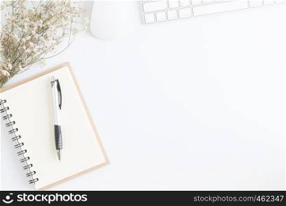 Flat lay photo of office desk with mouse and keyboard,White copyspace with pen top view